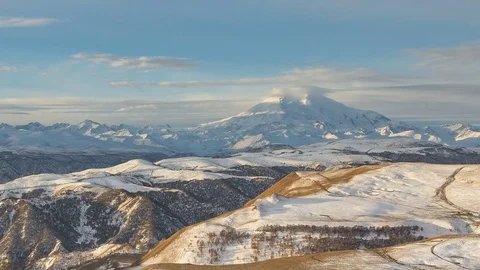 The formation and movement of clouds above the volcano Elbrus Stock Footage 70486534