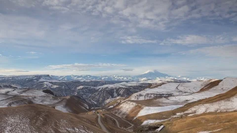The formation and movement of clouds above the volcano Elbrus Stock Footage 70486994