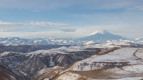 The formation and movement of clouds above the volcano Elbrus Stock Footage 70487075