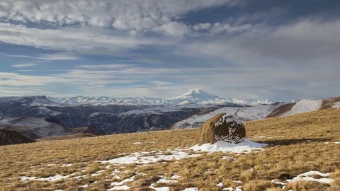 The formation and movement of clouds above the volcano Elbrus Stock Footage 70488118