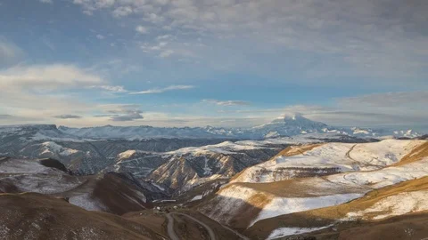 The formation and movement of clouds above the volcano Elbrus Stock Footage 70492485