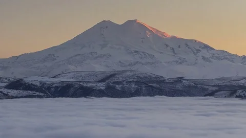 The formation and movement of clouds above the volcano Elbrus Stock Footage 70500992