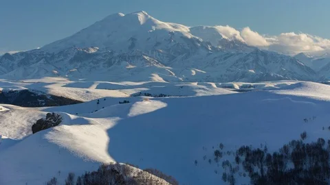 The formation and movement of clouds above the volcano Elbrus Stock Footage 72589077