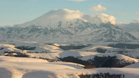 The formation and movement of clouds above the volcano Elbrus Stock Footage 72612396