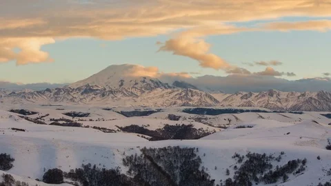 The formation and movement of clouds above the volcano Elbrus Stock Footage 72612937