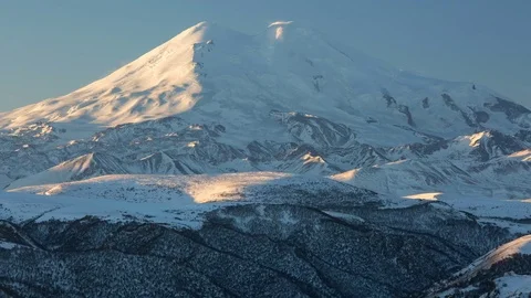 The formation and movement of clouds above the volcano Elbrus Stock Footage 72615320
