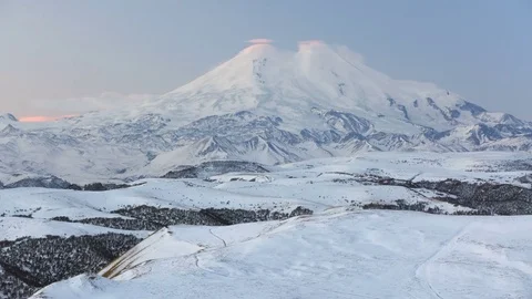 The formation and movement of clouds above the volcano Elbrus Stock Footage 72617431