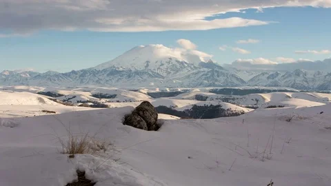 The formation and movement of clouds above the volcano Elbrus Stock Footage 72619015