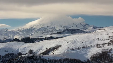 The formation and movement of clouds above the volcano Elbrus Stock Footage 72622860