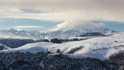 The formation and movement of clouds above the volcano Elbrus Stock Footage 72623479