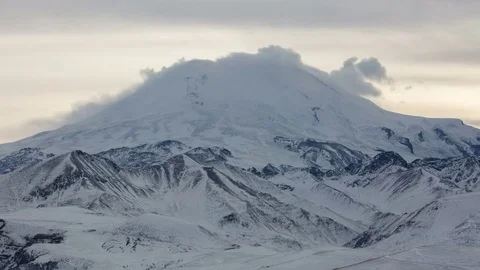 The formation and movement of clouds above the volcano Elbrus Stock Footage 72625996