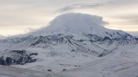 The formation and movement of clouds above the volcano Elbrus Stock Footage 72626732