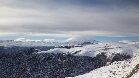 The formation and movement of clouds above the volcano Elbrus Stock Footage 73985824