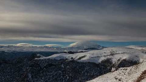 The formation and movement of clouds above the volcano Elbrus Stock Footage 73985984
