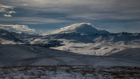 The formation and movement of clouds above the volcano Elbrus Stock Footage 74067943