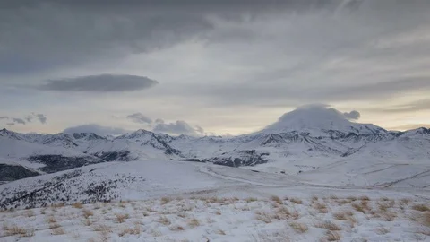 The formation and movement of clouds above the volcano Elbrus Stock Footage 74075362