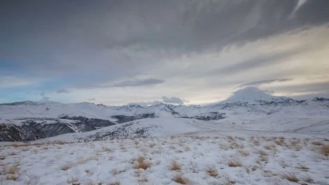 The formation and movement of clouds above the volcano Elbrus Stock Footage 74075505