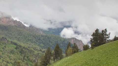 The formation and movement of clouds over the summer slopes of Bolshoy Thach Stock Footage 83493100