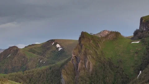 The formation and movement of clouds over the summer slopes of Bolshoy Thach Stock Footage 83493152