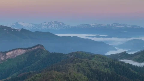 The formation and movement of clouds over the summer slopes of Bolshoy Thach Stock Footage 83493177