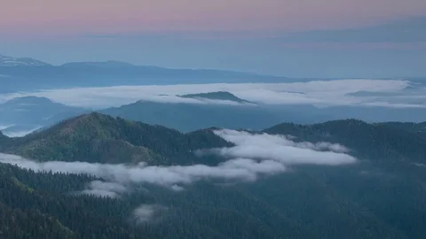The formation and movement of clouds over the summer slopes of Bolshoy Thach Stock Footage 83493179