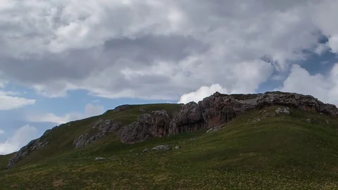 The formation and movement of clouds over the summer slopes of Bolshoy Thach Stock Footage 83493190