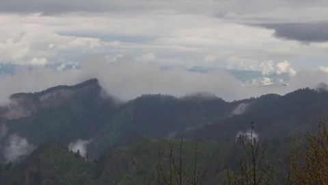 The formation and movement of clouds over the summer slopes of Bolshoy Thach Stock Footage 83493222