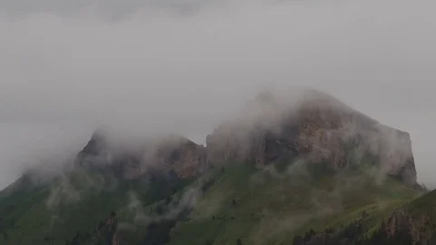 The formation and movement of clouds over the summer slopes of Bolshoy Thach Stock Footage 83493223