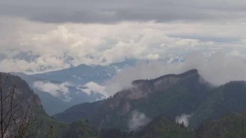 The formation and movement of clouds over the summer slopes of Bolshoy Thach Stock Footage 83493227