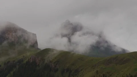 The formation and movement of clouds over the summer slopes of Bolshoy Thach Stock Footage 83493228