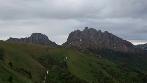 The formation and movement of clouds over the summer slopes of Bolshoy Thach Stock Footage 83493381