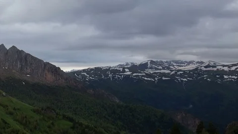 The formation and movement of clouds over the summer slopes of Bolshoy Thach Stock Footage 83493387