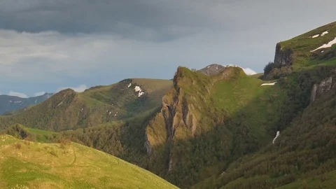 The formation and movement of clouds over the summer slopes of Bolshoy Thach Stock Footage 83493422