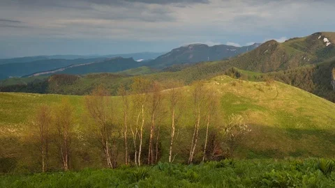 The formation and movement of clouds over the summer slopes of Bolshoy Thach Stock Footage 83493427