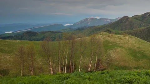 The formation and movement of clouds over the summer slopes of Bolshoy Thach Video stock 83493442
