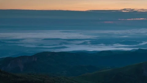 The formation and movement of clouds over the summer slopes of Bolshoy Thach Stock Footage 83493454