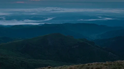 The formation and movement of clouds over the summer slopes of Bolshoy Thach Stock Footage 83493468