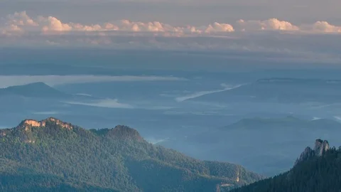 The formation and movement of clouds over the summer slopes of Bolshoy Thach Stock Footage 83493509