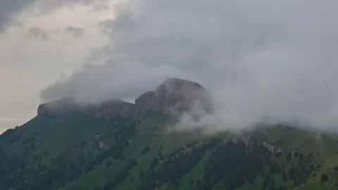 The formation and movement of clouds over the summer slopes of Bolshoy Thach Video stock 83493531