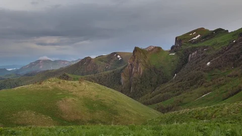 The formation and movement of clouds over the summer slopes of Bolshoy Thach Stock Footage 83518665