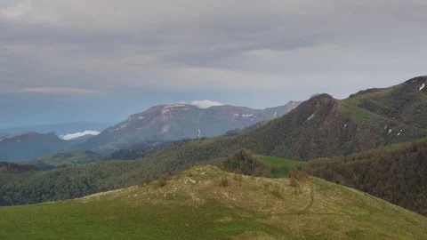 The formation and movement of clouds over the summer slopes of Bolshoy Thach Stock Footage 83518706