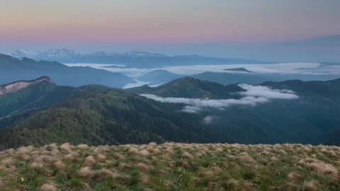 The formation and movement of clouds over the summer slopes of Bolshoy Thach Stock Footage 83518802