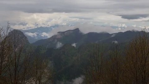 The formation and movement of clouds over the summer slopes of Bolshoy Thach Stock Footage 83519599