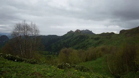 The formation and movement of clouds over the summer slopes of Bolshoy Thach Stock Footage 83591574