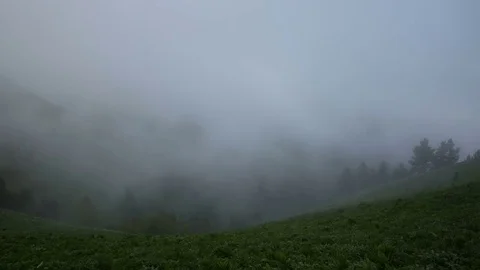 The formation and movement of clouds over the summer slopes of Bolshoy Thach Stock Footage 83592012