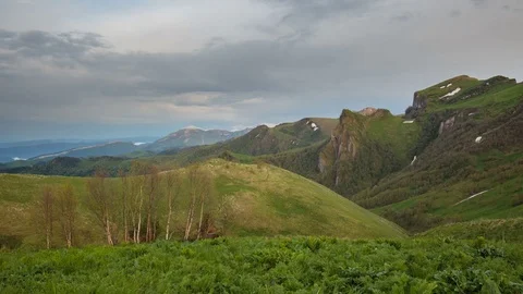 The formation and movement of clouds over the summer slopes of Bolshoy Thach Stock Footage 83593867