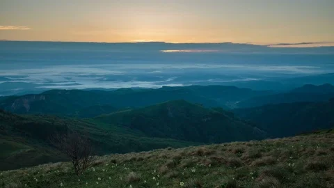 The formation and movement of clouds over the summer slopes of Bolshoy Thach Stock Footage 83594716