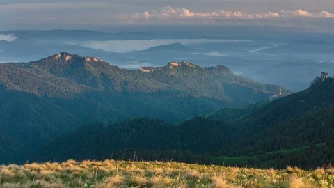 The formation and movement of clouds over the summer slopes of Bolshoy Thach Stock Footage 83594940