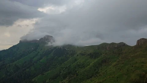The formation and movement of clouds over the summer slopes of Bolshoy Thach Video stock 83595221