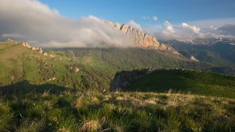 The formation and movement of clouds over the summer slopes of Bolshoy Thach Video stock 83597046